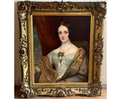 English School, Portrait of a Young Lady in a Paisley Shawl, half-length, oil on board, in an elaborate gilt-composition fram