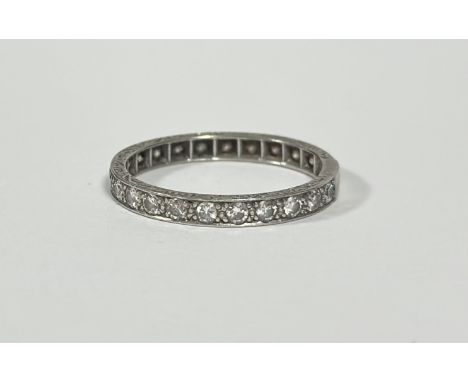 A full hoop diamond eternity ring, the twenty-two round brilliant-cut stones millegrain set in white metal, unmarked. Total d