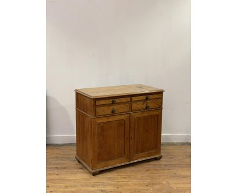 A George III satin birch writing cabinet, early 19th century, the top with moulded edge above a pull out writing slide with g