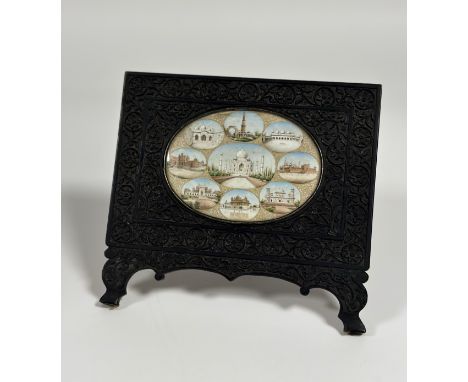 An Indian watercolour miniature on ivory, late 19th century, the oval ivory panel painted with nine oval cartouches of notabl