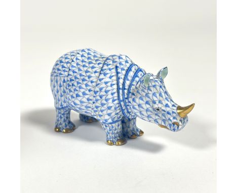 A Herend porcelain model of a rhinoceros in the blue scale pattern, printed mark. Length 12.5cm