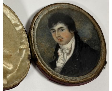 English School, early 19th century, a portrait miniature of a young man in a white stock, oval, unsigned, watercolour on ivor