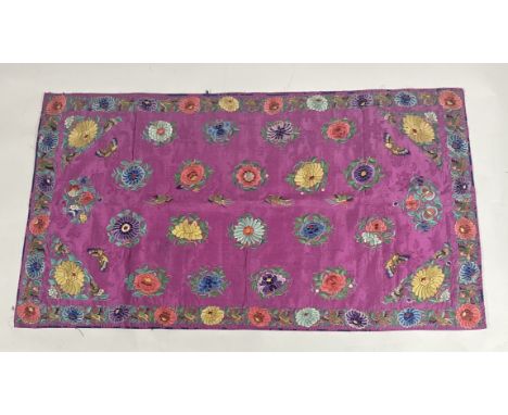 A Chinese embroidered silk panel, rectangular, worked with butterflies, chrysanthemums and birds in coloured and gilt threads