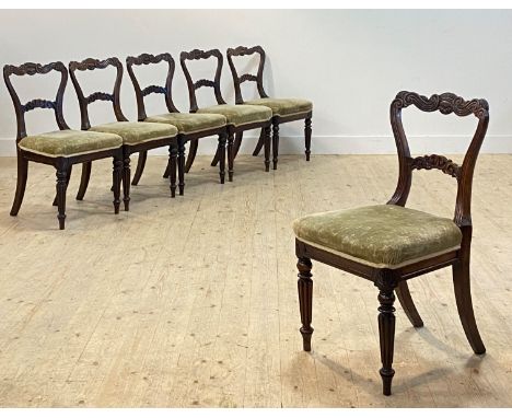 A set of six Regency rosewood dining chairs, in the manner of William Trotter, the well carved back rest of conforming 'S' sc