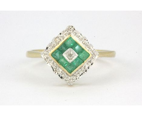 A 9ct yellow gold emerald and diamond set cluster ring, (M).