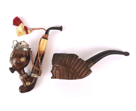 A Swiss tobacco pipe and a carved Indian head tobacco pipe, L. 14cm.