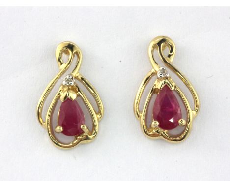 A pair of 9ct yellow gold ruby and diamond set earrings, L. 1.2cm.