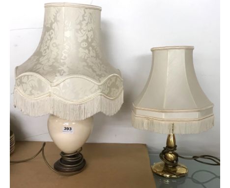 A group of six ceramic and brass table lamps.