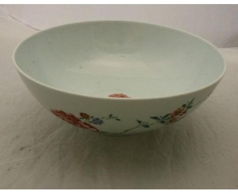 A Chinese bowl polychrome decorated with floral sprays raised on a circular foot bearing faux Yongzheng mark together with an