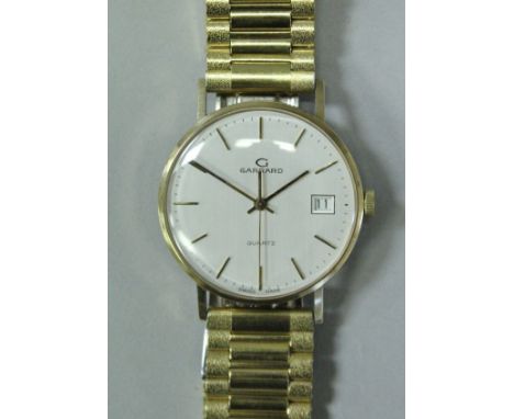 A late 20th Century 9 carat gold cased Garrard wristwatch with plated strap CONDITION REPORTS Unknown if working, no visiible