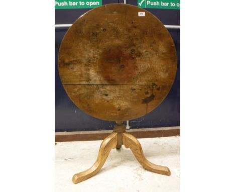 A 19th Century French Provincial cherry wood circular drop leaf dining table on turned tapering legs, together with a 19th Ce