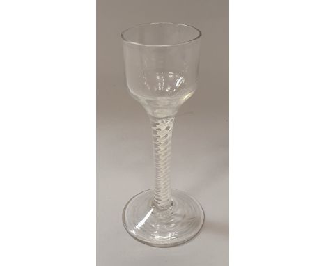 A late 18th/early 19th Century wine glass with ogee bowl on a double series opaque twist decorated stem to circular foot COND