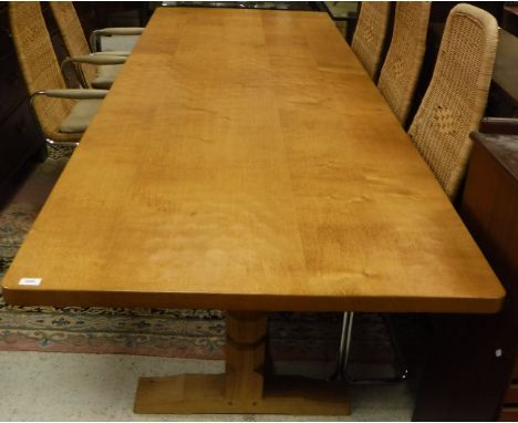 A Robert Thompson of Kilburn (The Mouseman) refectory style dining table with adzed top raised on twin pillar supports united