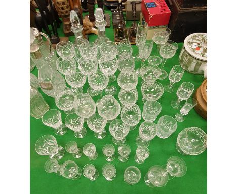 A collection of various cut glassware to include eight hock glasses, two decanters, nine various brandy balloons, various liq