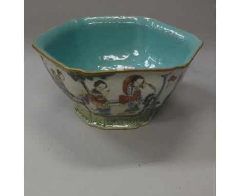 A late 19th Century Chinese polychrome decorated hexagonal bowl decorated with figures in a garden setting, bearing Xianfeng 