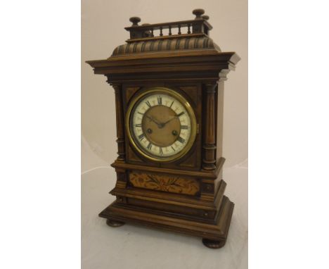 A 19th Century walnut and marquetry inlaid cased mantel clock, the eight day movement by HAC of Gothenburg