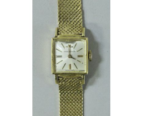 An 18 carat gold Jaeger Lecoultre ladies wristwatch, the square dial set with numeral markers inscribed "Jaeger Lecoultre", i