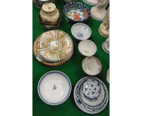 A collection of small Oriental porcelain and pottery to include Satsuma bowl and lidded vase, various small blue and white wa