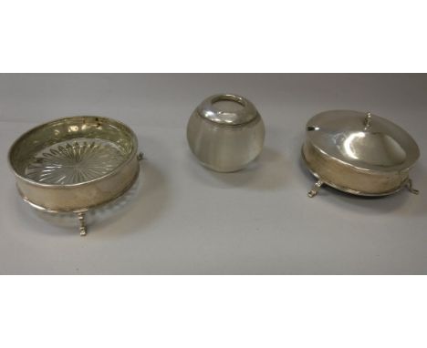 A pair of silver mounted cut glass preserve dishes (Birmingham 1945), together with a silver mounted ribbed glass lighter, 3.