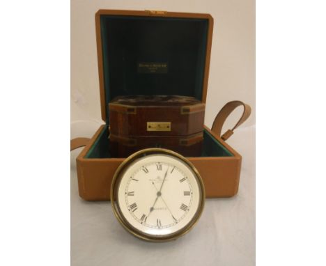 A Baume &amp; Mercier clock as a marine chronometer in polished brass case within a mahogany and brass bound outer case and p