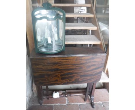 A 19th Century mahogany Pembrook table with claw and ball feet together with a green painted Colefax and Fowler wall light