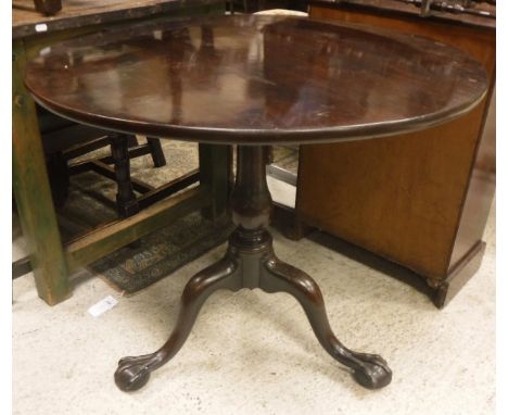 A Georgian mahogany circular top tripod table with birdcage base