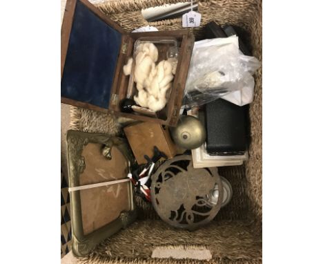 A box containing various metal wares including Bonzo iron trivet, Art Nouveau style mirror, pair of Scottie dog bookends, Kod