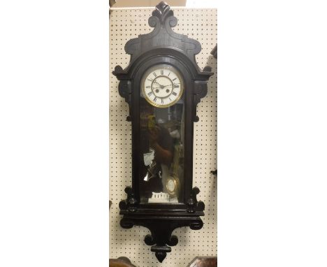 A simulated rosewood cased Vienna type regulator, the circular enamelled dial with Roman numerals (together with receipt from