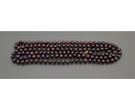 A single strand Tahitian South Sea style pearl necklace with 14 carat gold clasp, approx 132 cm long