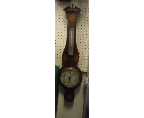 An early 20th Century mahogany and inlaid aneroid barometer/thermometer, the brushed steel barometer dial inscribed Negretti 