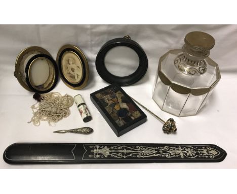 A box of various ornamental items including an ebony and ivory inlaid paperknife or page turner, Guerlain of Paris gilt decor