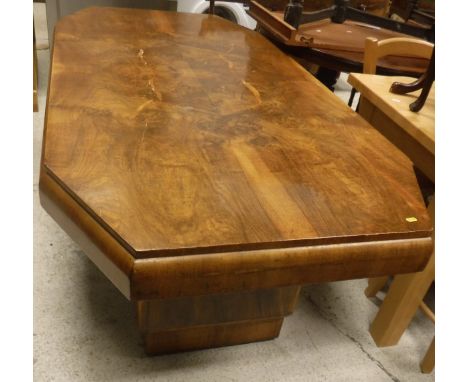 A 1930s Art Deco walnut-veneered elongated octagonal dining table on stepped end pillar supports, together with an Edwardian 