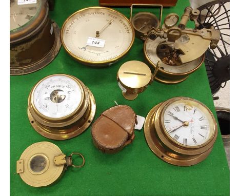 A brass framed holosteric barometer with silvered dial by TB Winter of Newcastle upon Tyne together with a Stanley pocket com