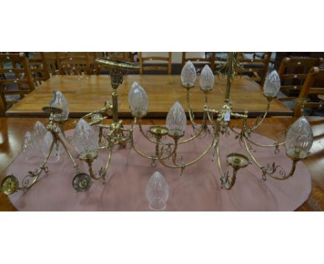 A 19th century style gilt-brass light suite, comprising a two-tier eight-branch electrolier and a pair of wall lights, scroll
