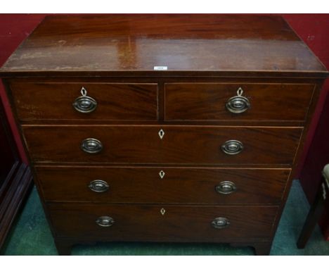 A George III mahogany chest of two short over three long graduated drawers, brass swing handles, bracket feet