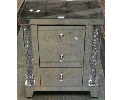 A mirrored three drawer chest, column supports, approx 66cm high, 56cm wide, raised on bracket feet