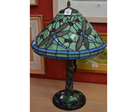 A Tiffany style table lamp, the shade and base decorated with dragonflies