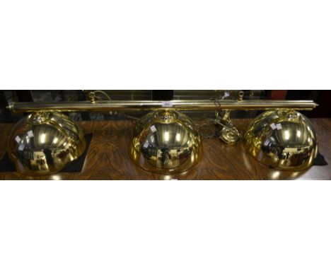 A brass coloured, ceiling mounted snooker table light 