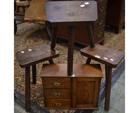 Three elm miniature tripod stools; an oak table cabinet (4)