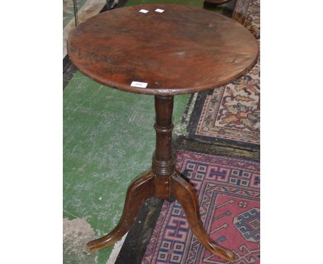 An oak tripod occasional table