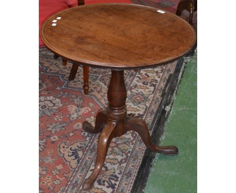 A George III mahogany tripod supper table, dished circular one-piece top, birdcage type support, baluster column, cabriole le