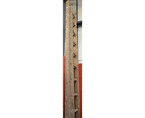 A vintage wooden two section extending ladder, closed approx 12ft/363cm long