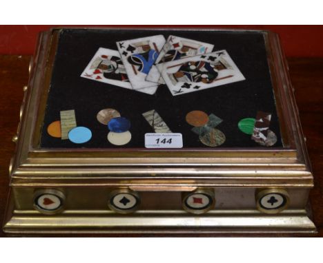A gilt metal and pietra dura playing card box, the hinged cover enclosing four sectioned compartments, 33cm wide