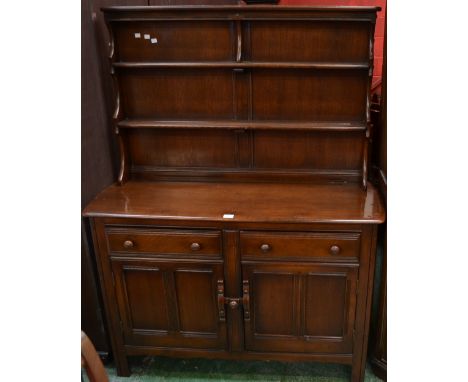 An Ercol dresser, plate rack above base with two short drawers and cupboards