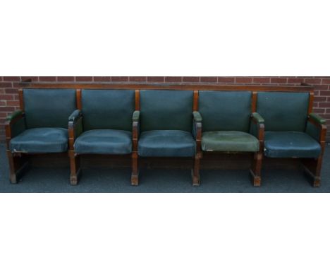 An early 20th century oak framed jury bench, five leather tilting seats, 297cm long, provenance: Derby City Court House