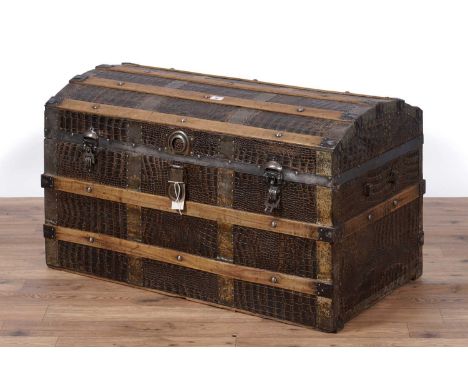 An early 20th Century pine and faux crocodile skin metal bound 'treasure trunk', with domed top, 92 x 49 x 56cms high.