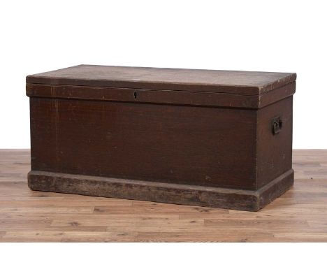 A vintage stained pine two handled blanket box, the top opening to reveal storage area with hinged compartment above two draw