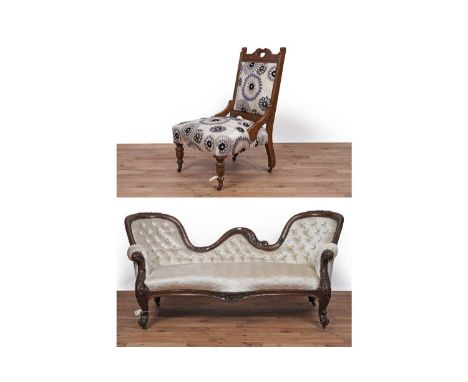 A Victorian style mahogany framed serpentine fronted button back sofa, with foliate carved top rail and cabriole legs, uphols