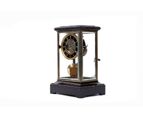A black onyx and marble four-glass mantle clock, the enamelled chapter ring with Roman dial, the movement stamped ‘GV’, 24 x 