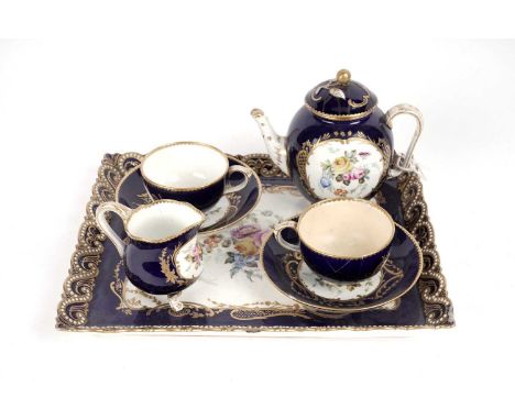 A Royal Worcester 'Tete a Tete' service in Sèvres style, 1869, each piece painted with panels of summer flowers on a midnight
